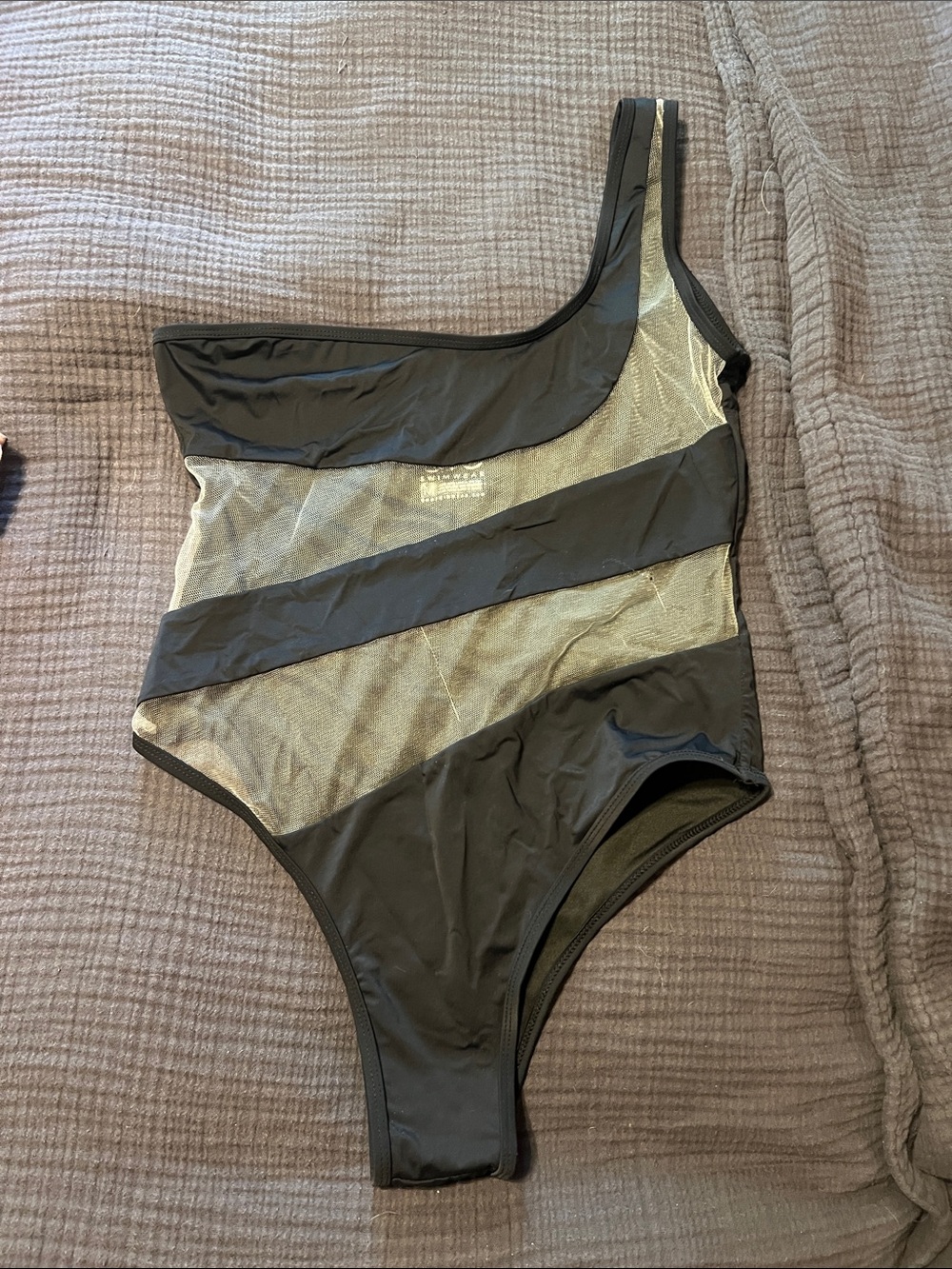 Asymmetrical Black One-Piece Swimsuit with Gold Mesh Panels
